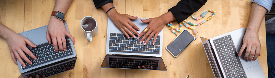 CRM Roundtable Hands typing on laptops